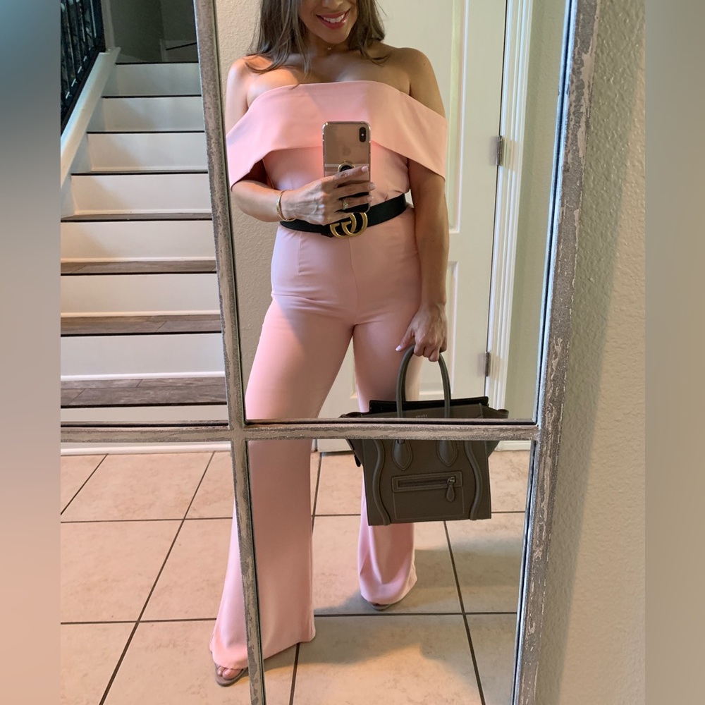 Like new jumpsuit. Size 2/4. Worn once for event. Belt not included.